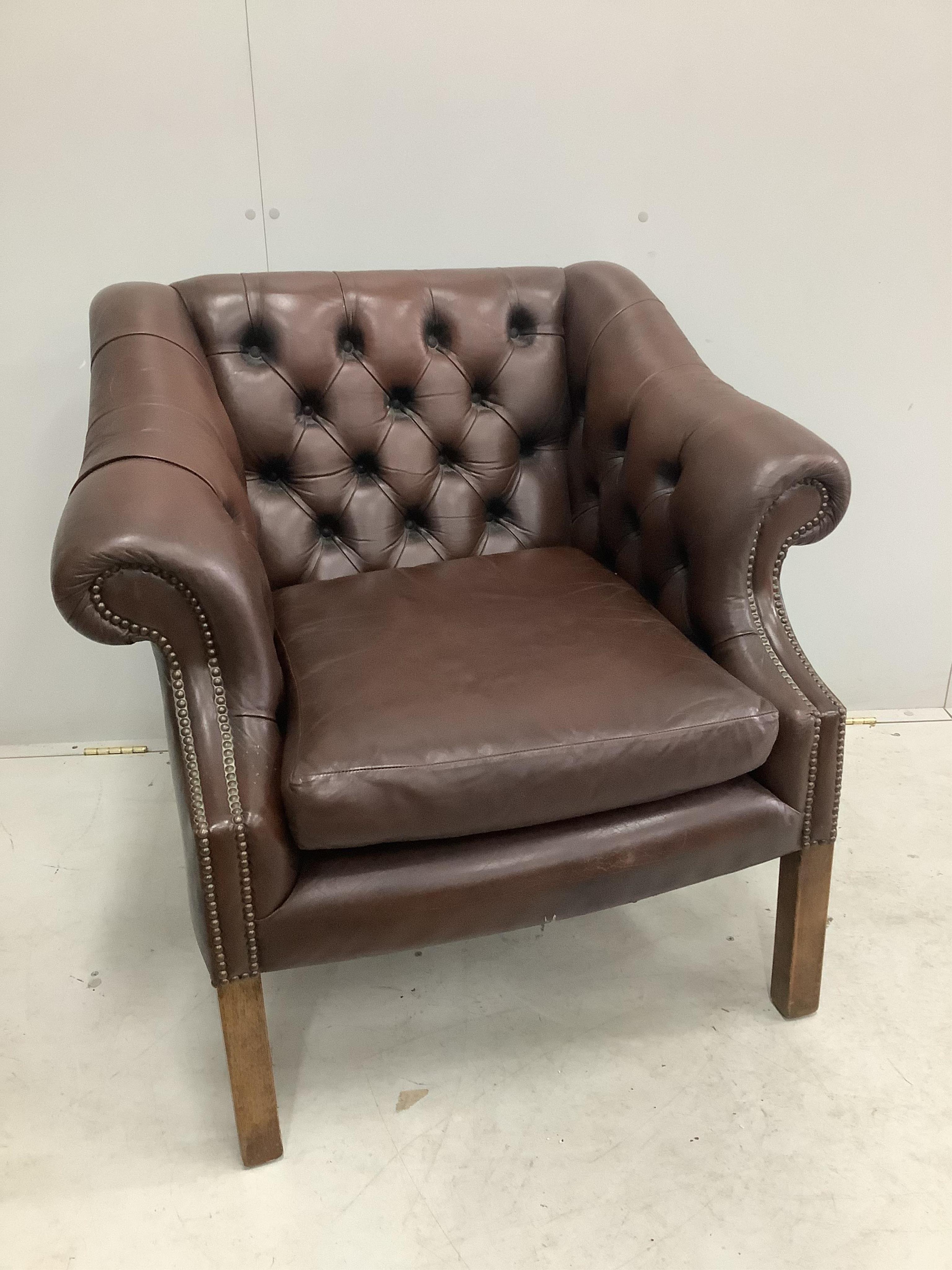 A George III style buttoned brown leather club chair, width 90cm, depth 76cm, height 82cm. Condition - fair